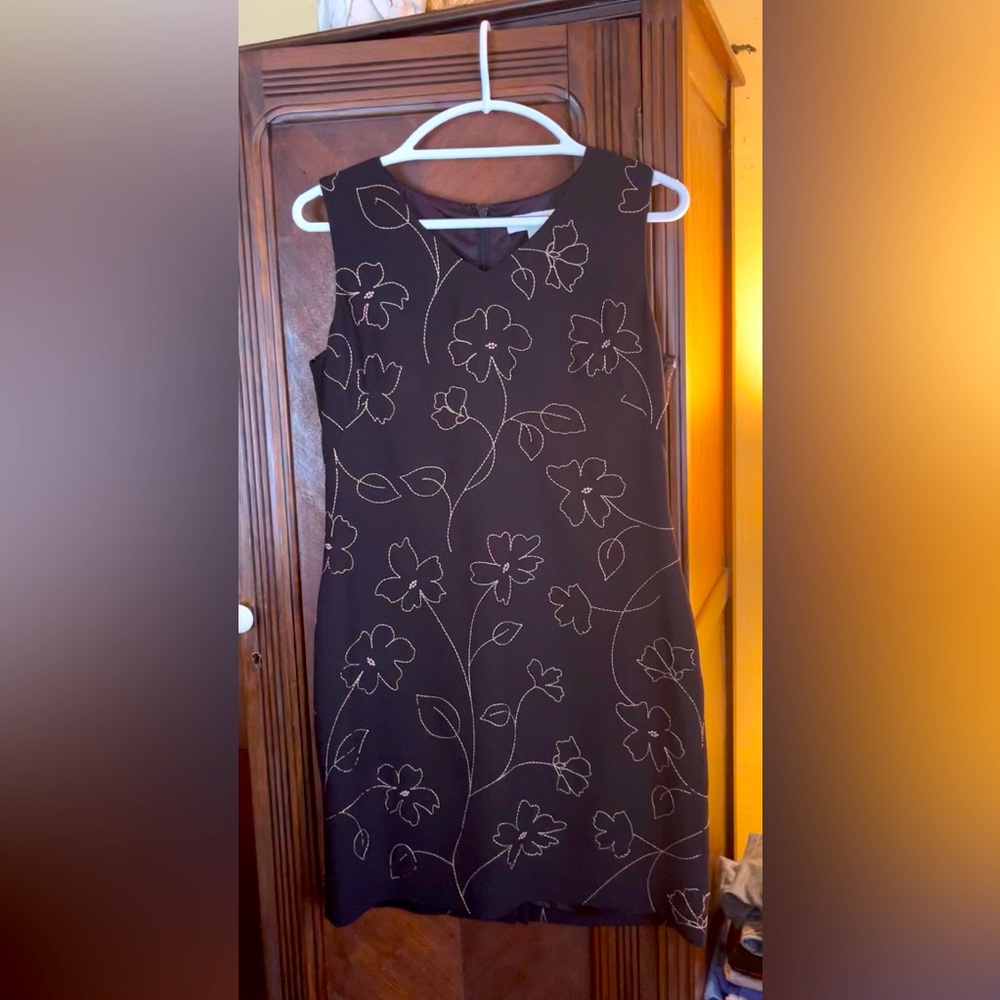 Ladies size 8 Petite Sophisticate black dress with gold flowers.